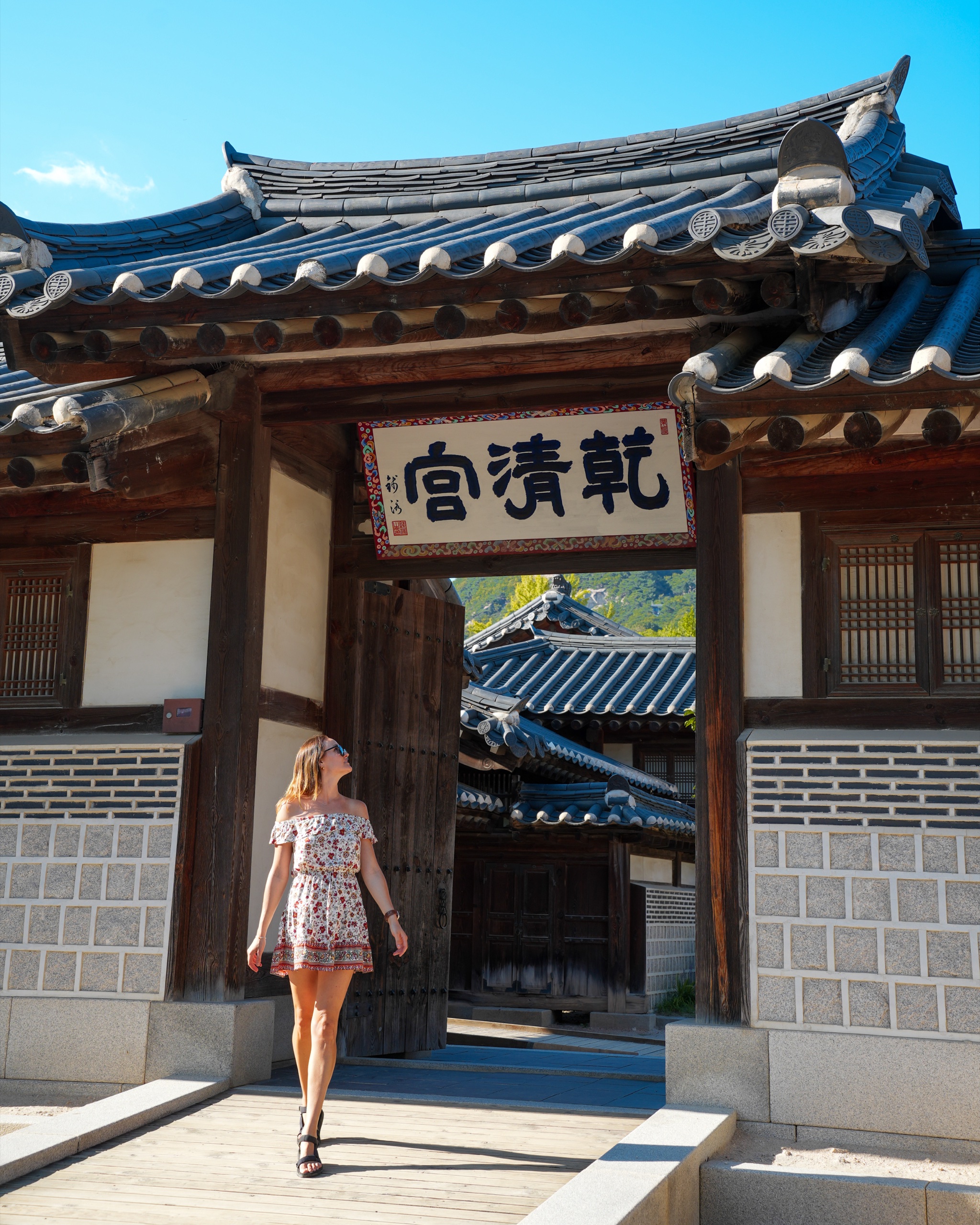 Polina walking through the Geoncheonggung gate at Gyeongbokgung Palace